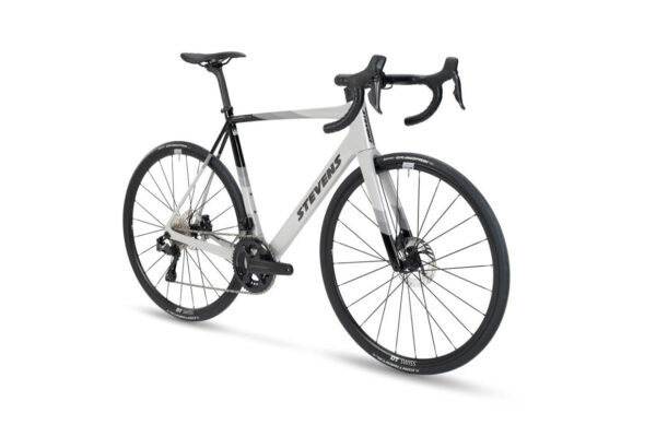 Stevens road bike with gray and black aero frame, drop handlebars, and disc brakes ready for racing on a white background.