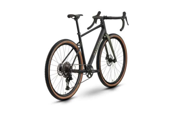 Black gravel bike with drop handlebars and tan gumwall tires, shown from a rear three-quarter view.